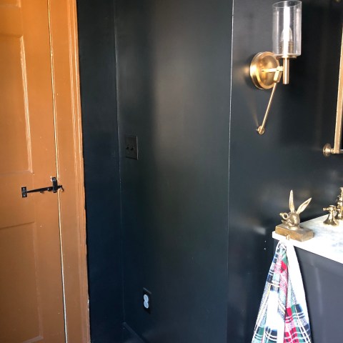 a band performing on stage in front of a mirror posing for the camera