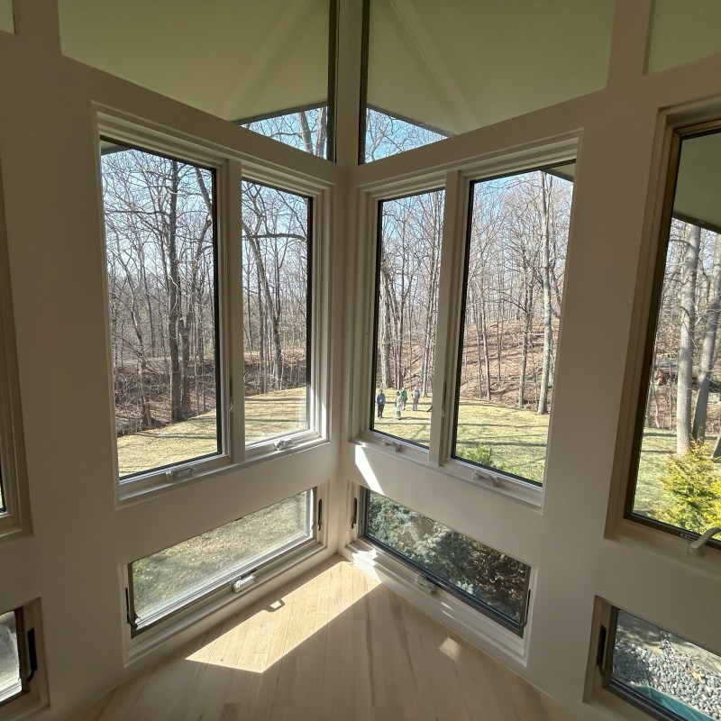 a room filled with furniture and a large window