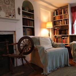 a living room with a book shelf