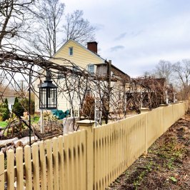 a building next to a fence
