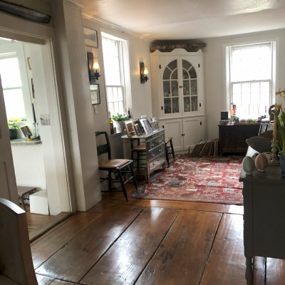 a living room filled with furniture and a fire place