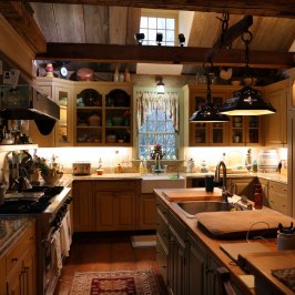 a couple of people that are standing in the kitchen