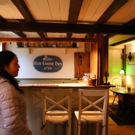 a man and a woman standing in a kitchen