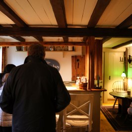 a man standing in front of a restaurant