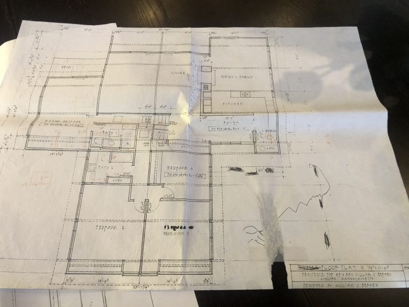 Floor plan sketch with handwritten notes on a worn paper.